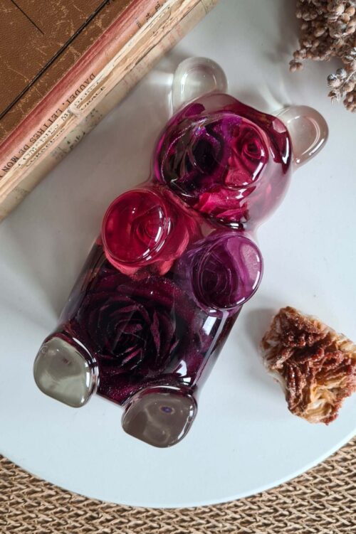 Charming Teddy, a luxurious gummy bear shaped artpiece made of crystal clear resin with red roses in it