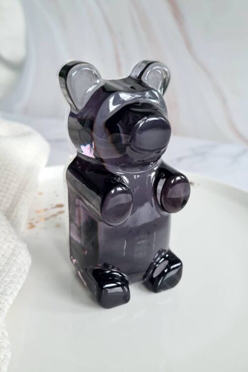Charming Teddy, a luxurious gummy bear shaped artpiece made of black resin and has a stunning high gloss finish