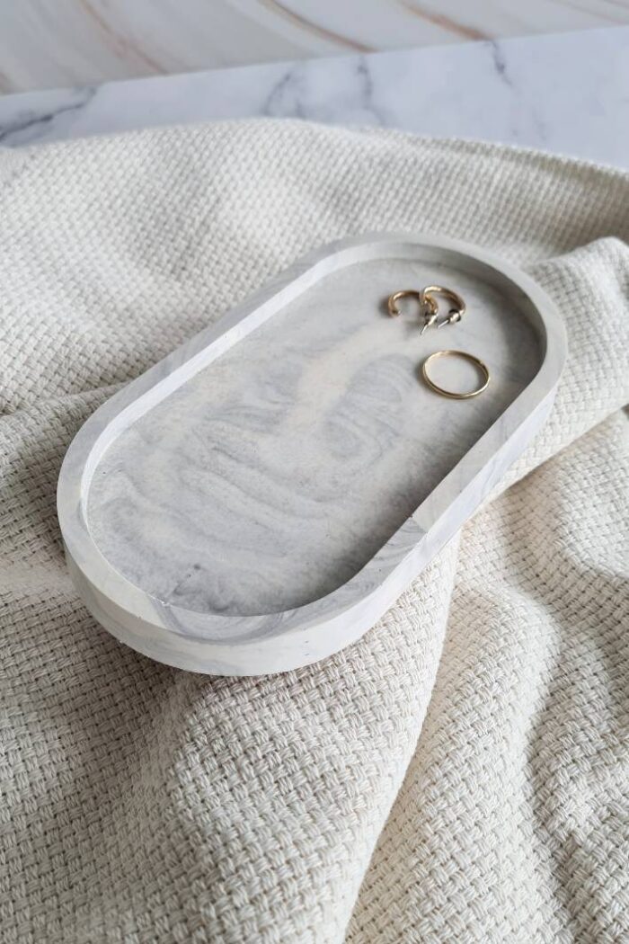 Oval jewerly dish made with gray and white Jesmonite