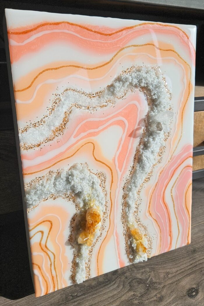 Handmade pink and orange resin wall art with rock crystal and citrine crystal.